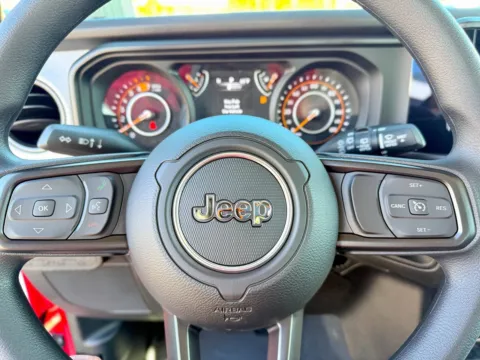 Photos of 2026 Jeep Wrangler Sport for sale in Gulfport, MS at Champion Chrysler Dodge Jeep Ram