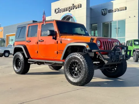 Orange 2015 Jeep Wrangler Unlimited Sport for sale in Gulfport, MS