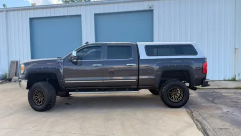 Photos of 2015 GMC Sierra 1500 4WD Crew Cab 143.5" SLT for sale in Dayton, OH at Dayton Work Trucks