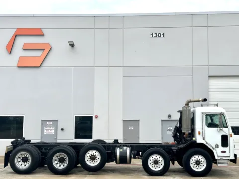 Another view of 2002 PETERBILT 320 for sale in Hutchins, TX at Forge Truck Centers - Texas