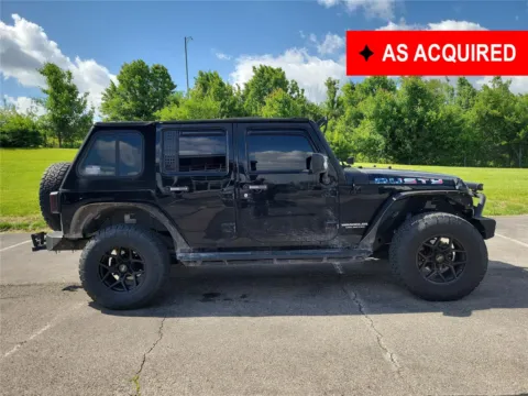 Black 2013 Jeep Wrangler Unlimited Sport for sale in Hamilton, OH