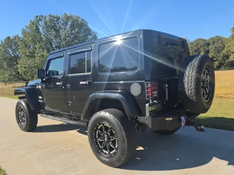 Another view of 2014 Jeep Wrangler Unlimited Sahara for sale in Austin, AR at Premier MotorCars LLC