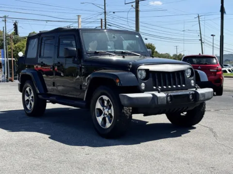 Black 2017 JEEP WRANGLER UNLIMI SAHARA for sale in Knoxville, TN