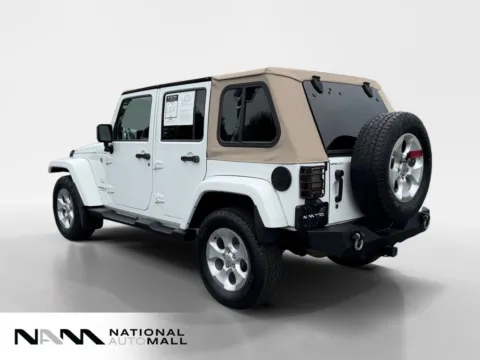 Another view of 2014 Jeep Wrangler Unlimited Sahara for sale in Merritt Island, FL at National Auto Mall
