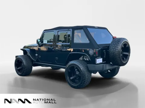 Another view of 2013 Jeep Wrangler Unlimited Freedom Edition for sale in Merritt Island, FL at National Auto Mall