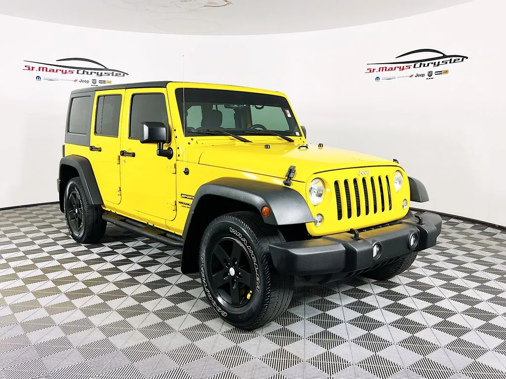Yellow 2015 Jeep Wrangler Unlimited Sport for sale in Saint Marys, OH