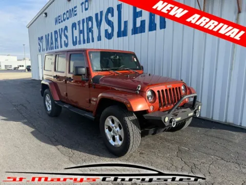 Red 2014 Jeep Wrangler Unlimited Sahara for sale in Saint Marys, OH