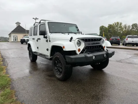 Another view of 2013 Jeep Wrangler Unlimited Sahara Sport Utility 4D for sale in Lancaster, OH at Instant Auto Sales Lancaster
