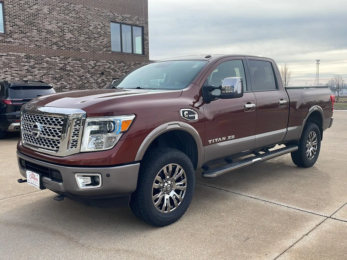 Orange 2016 Nissan Titan XD Platinum Reserve for sale in Boone, IA