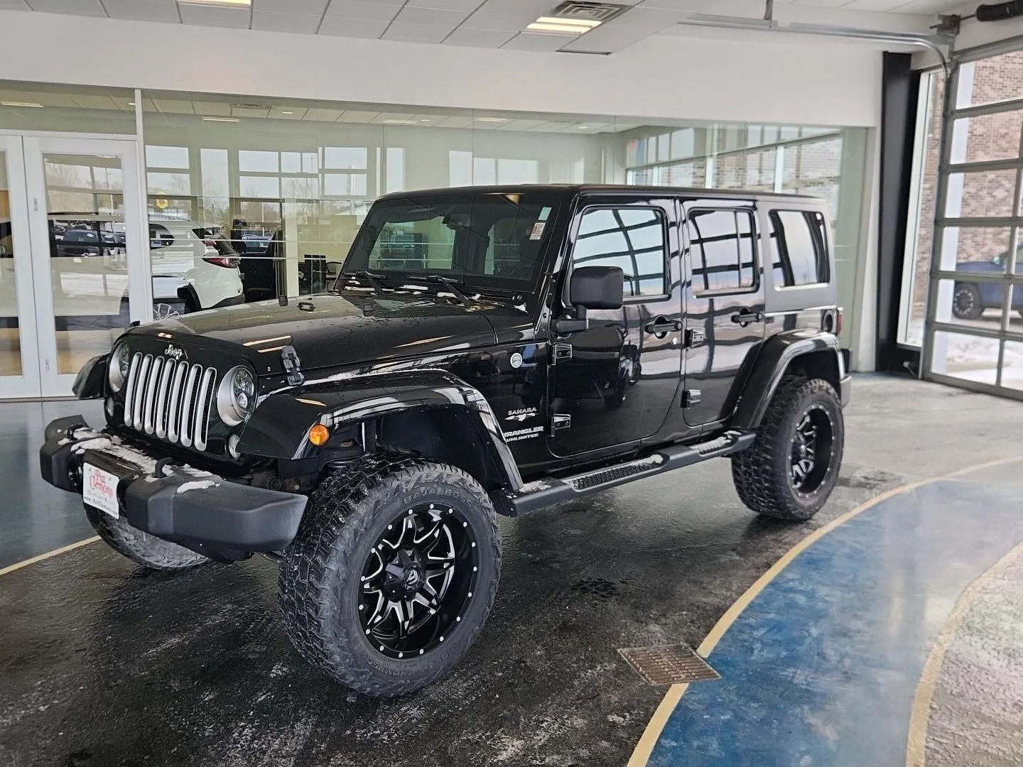 Black 2016 Jeep Wrangler Unlimited Sahara for sale in Boone, IA