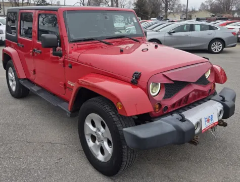 Photos of 2013 Jeep Wrangler Unlimited Sahara for sale in Des Moines, IA at Capital City Motor Company