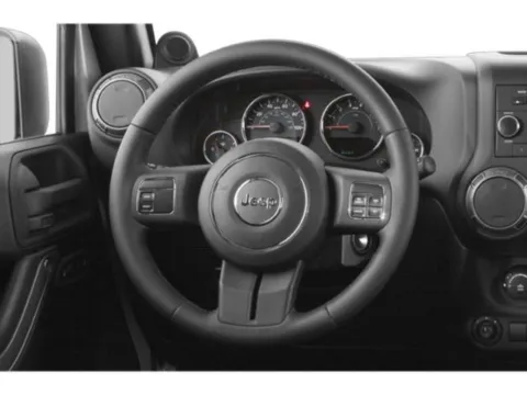 Photos of 2015 Jeep Wrangler Unlimited Sport for sale in Des Moines, IA at Capital City Motor Company
