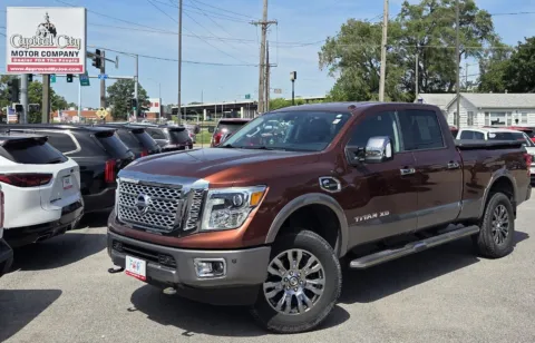 Orange 2016 Nissan Titan XD Platinum Reserve for sale in Des Moines, IA