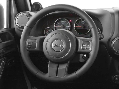 Photos of 2013 Jeep Wrangler Unlimited Sport for sale in Des Moines, IA at Capital City Motor Company