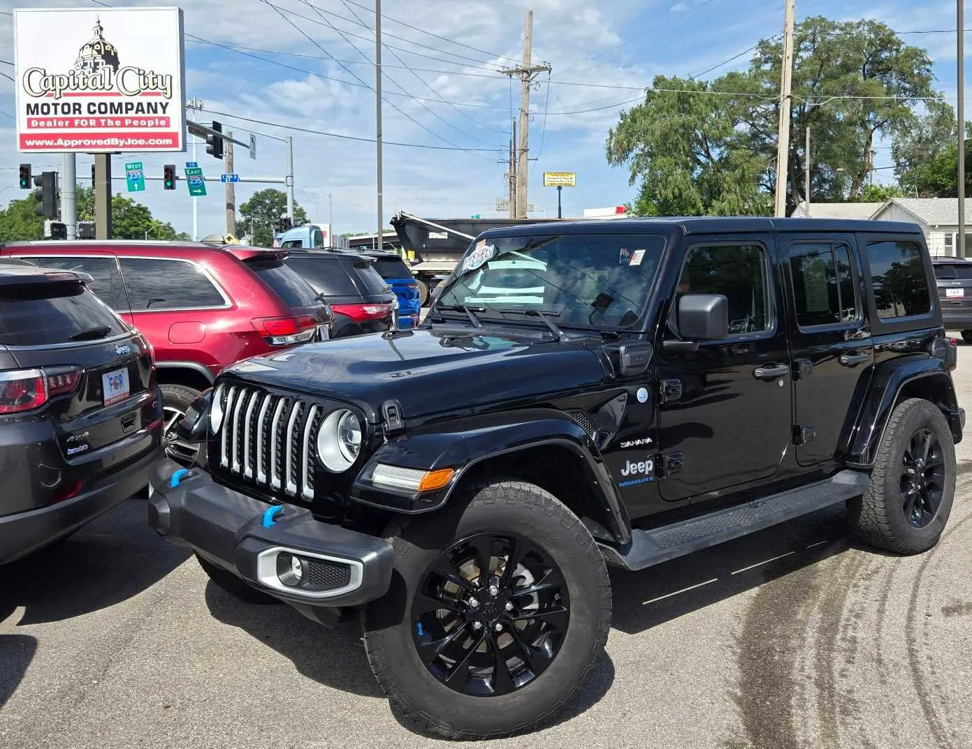 Black 2023 Jeep Wrangler 4xe Sahara for sale in Des Moines, IA