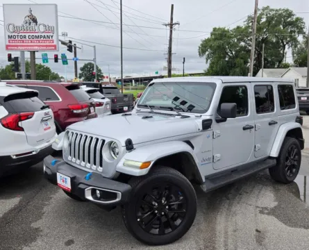 Silver 2023 Jeep Wrangler 4xe Sahara for sale in Des Moines, IA