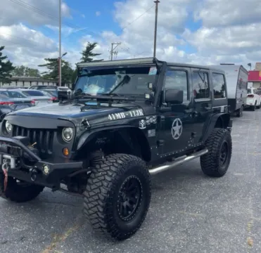 Green 2011 Jeep Wrangler Unlimited Sport SUV 4D for sale in Wadena, MN
