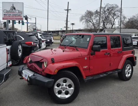 Red 2013 Jeep Wrangler Unlimited Sahara for sale in Des Moines, IA