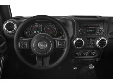 Photos of 2015 Jeep Wrangler Unlimited Sahara for sale in Des Moines, IA at Capital City Motor Company