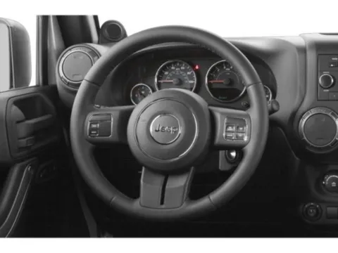 Photos of 2015 Jeep Wrangler Unlimited Sport for sale in Des Moines, IA at Capital City Motor Company