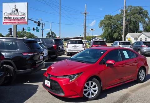 Red 2021 Toyota Corolla LE for sale in Des Moines, IA