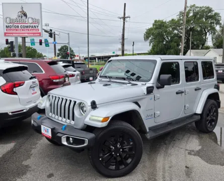 Silver 2023 Jeep Wrangler 4xe Sahara for sale in Des Moines, IA