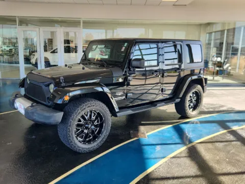 Black 2015 Jeep Wrangler Unlimited Sahara for sale in Boone, IA