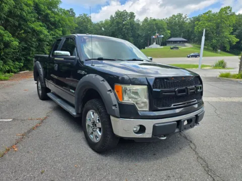 Black 2013 Ford F-150 Super Cab XLT Pickup 4D 6 1/2 ft for sale in Ashland, KY