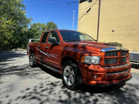Orange 2005 Dodge Ram 1500 Quad Cab SLT Pickup 4D 6 1/4 ft for sale in Ashland, KY