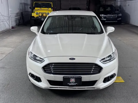 Photos of 2013 Ford Fusion Hybrid Titanium for sale in Denver, CO at Automotive Imports Sales & Service