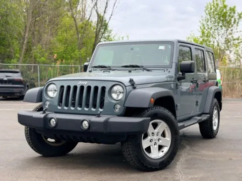 Gray 2015 Jeep Wrangler Unlimited Sport for sale in Davison, MI