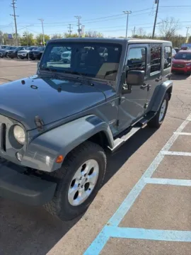 Gray 2014 Jeep Wrangler Unlimited Sahara for sale in Davison, MI