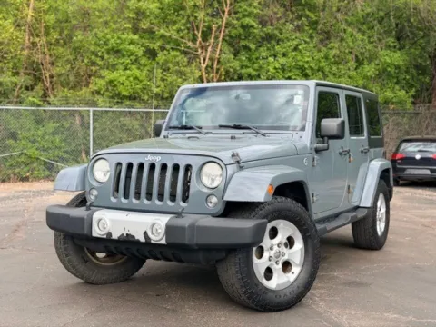 Gray 2014 Jeep Wrangler Unlimited Sahara for sale in Davison, MI