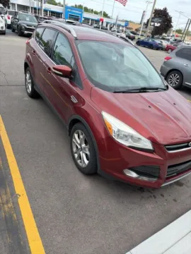 Orange 2014 Ford Escape Titanium for sale in Davison, MI