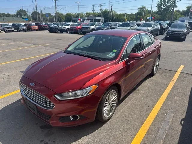 Orange 2014 Ford Fusion SE for sale in Davison, MI