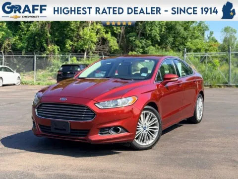 Orange 2014 Ford Fusion SE for sale in Davison, MI
