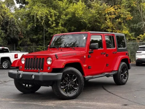 Red 2015 Jeep Wrangler Unlimited Sahara for sale in Davison, MI