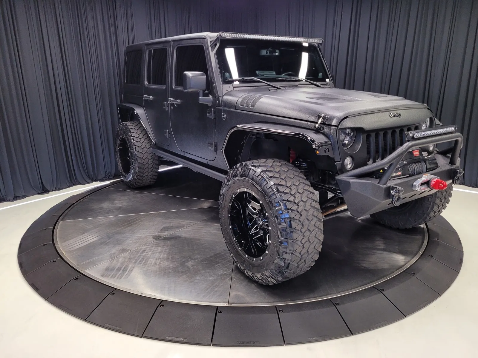 More photos of 2014 Jeep Wrangler Unlimited Sport at HyperCars, IN