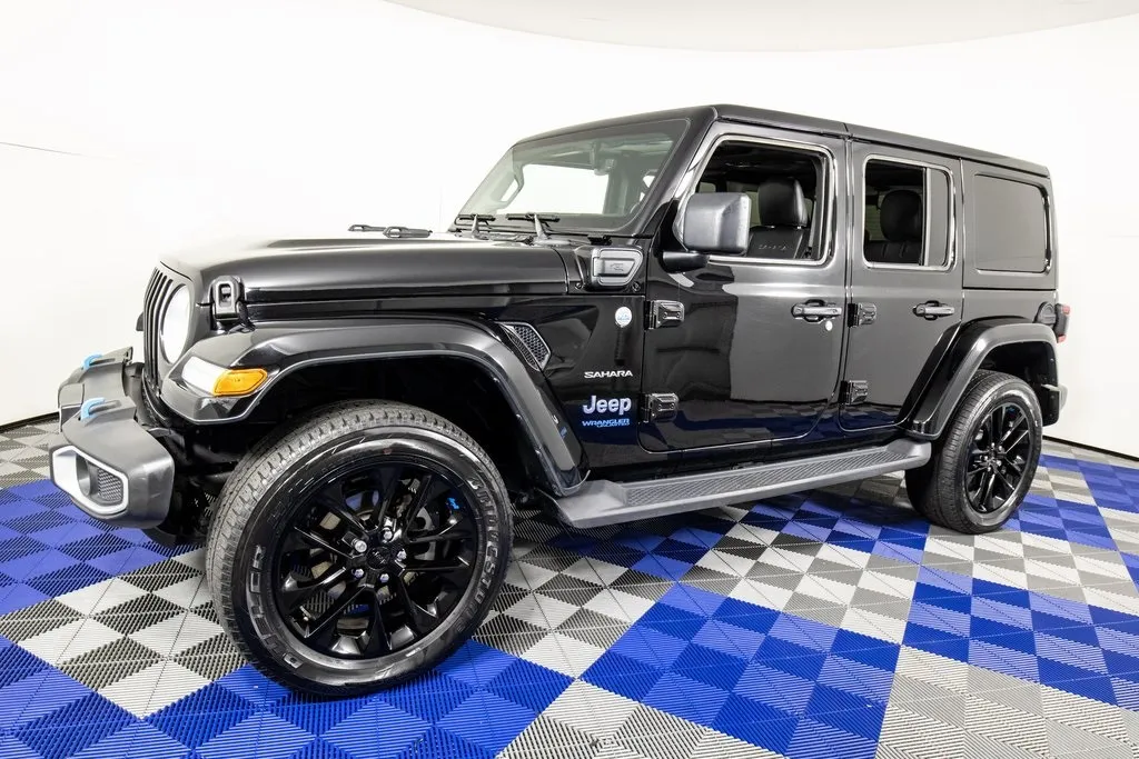 Black 2022 Jeep Wrangler Unlimited Sahara 4xe for sale in Austin, TX