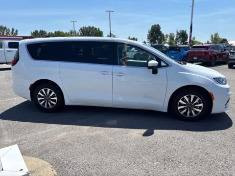 Photos of 2023 Chrysler Pacifica Hybrid Touring L for sale in Powderly, KY at Pogue Chrysler Dodge Jeep RAM FIAT