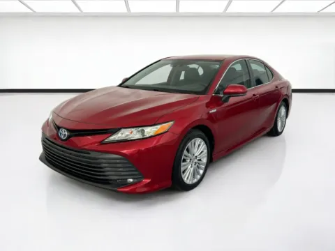 Red 2021 Toyota Camry Hybrid LE for sale in Chandler, AZ