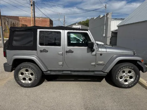 Another view of 2014 Jeep Wrangler Unlimited Sahara for sale in Dunkirk, IN at Glass Capital CDJR