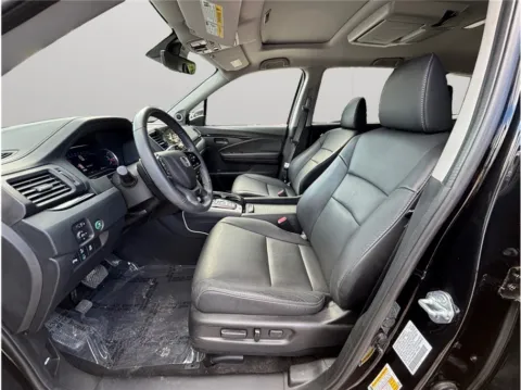 Photos of 2022 Honda Pilot Touring Sport Utility 4D for sale in Jacksonville, FL at Merit Auto Group Lem Turner