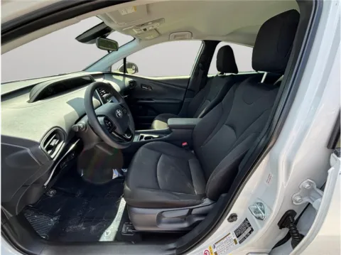 Photos of 2021 Toyota Prius L Eco Hatchback 4D for sale in Jacksonville, FL at Merit Auto Group Lem Turner