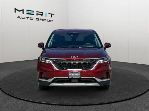 Another view of 2023 Kia Carnival EX Minivan 4D for sale in Jacksonville, FL at Merit Auto Group Lem Turner