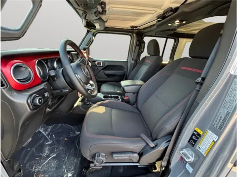 Photos of 2023 Jeep Wrangler Unlimited Rubicon Sport Utility 4D for sale in Jacksonville, FL at Merit Auto Group Lem Turner
