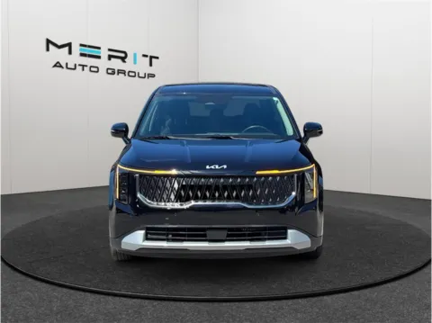 Another view of 2026 Kia Carnival Hybrid LXS Van 4D for sale in Jacksonville, FL at Merit Auto Group Lem Turner