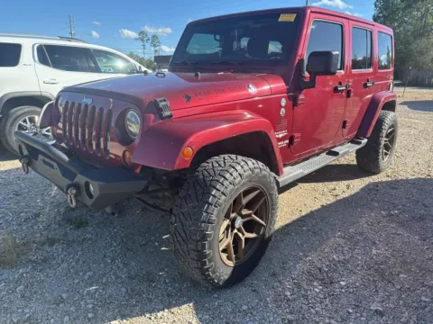 Red 2011 Jeep Wrangler Unlimited Sahara for sale in Crestview, FL