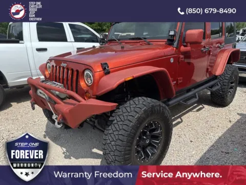 Orange 2009 Jeep Wrangler Unlimited Rubicon for sale in Crestview, FL