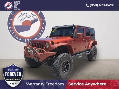 Orange 2009 Jeep Wrangler Unlimited Rubicon for sale in Crestview, FL